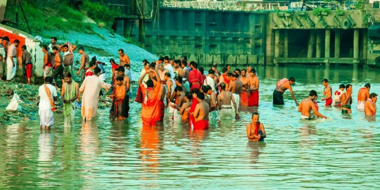 Kolkata, India - January 14, 2016:Devotees taking holy dip at Har Ki Pauri on river Ganga on the first bath of Ardh Kumbh fair. People took a dip in holy Ganges on the occasion of Makar Sankranti